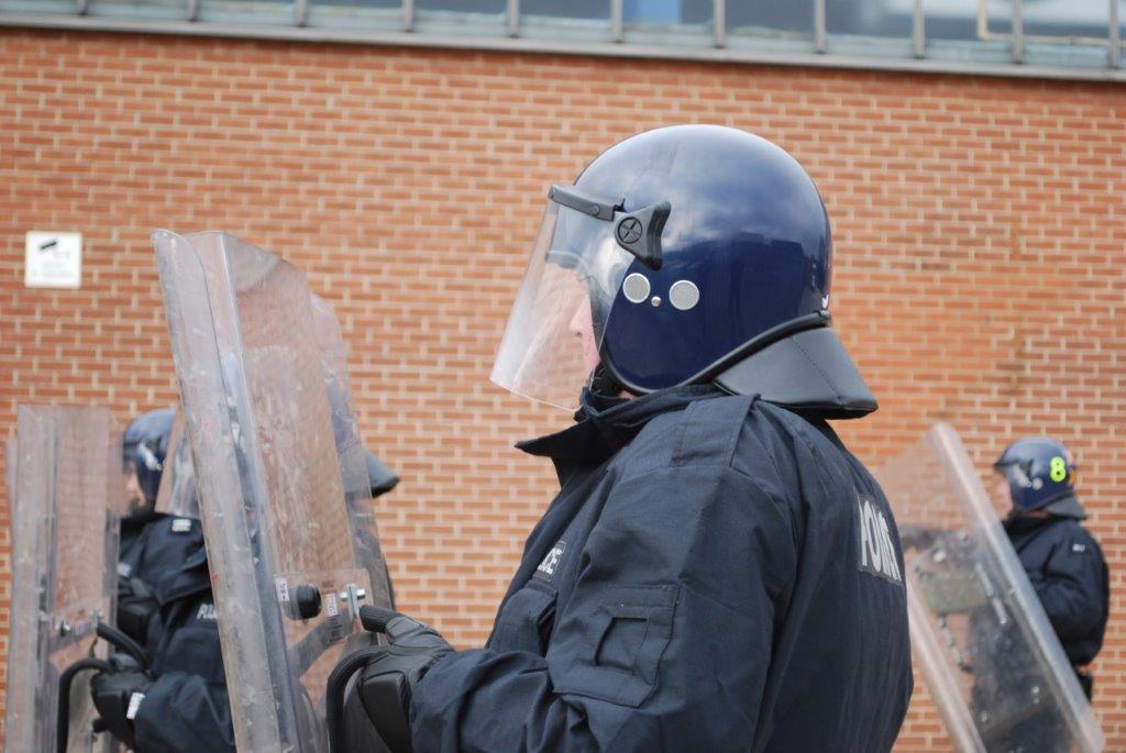 Officers training with riot equipment